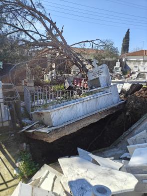Storm damage raises marble graves above ground