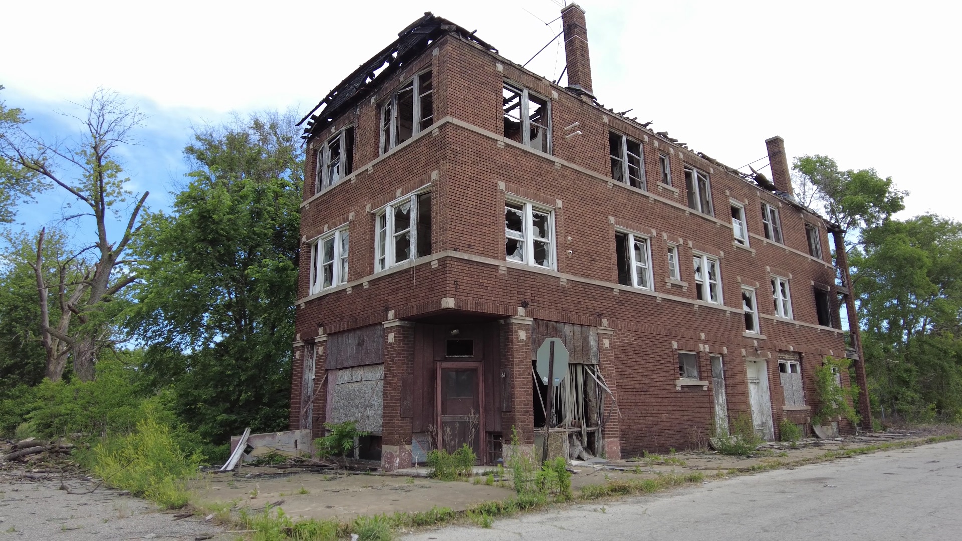 Abandoned apartment building with small storefront