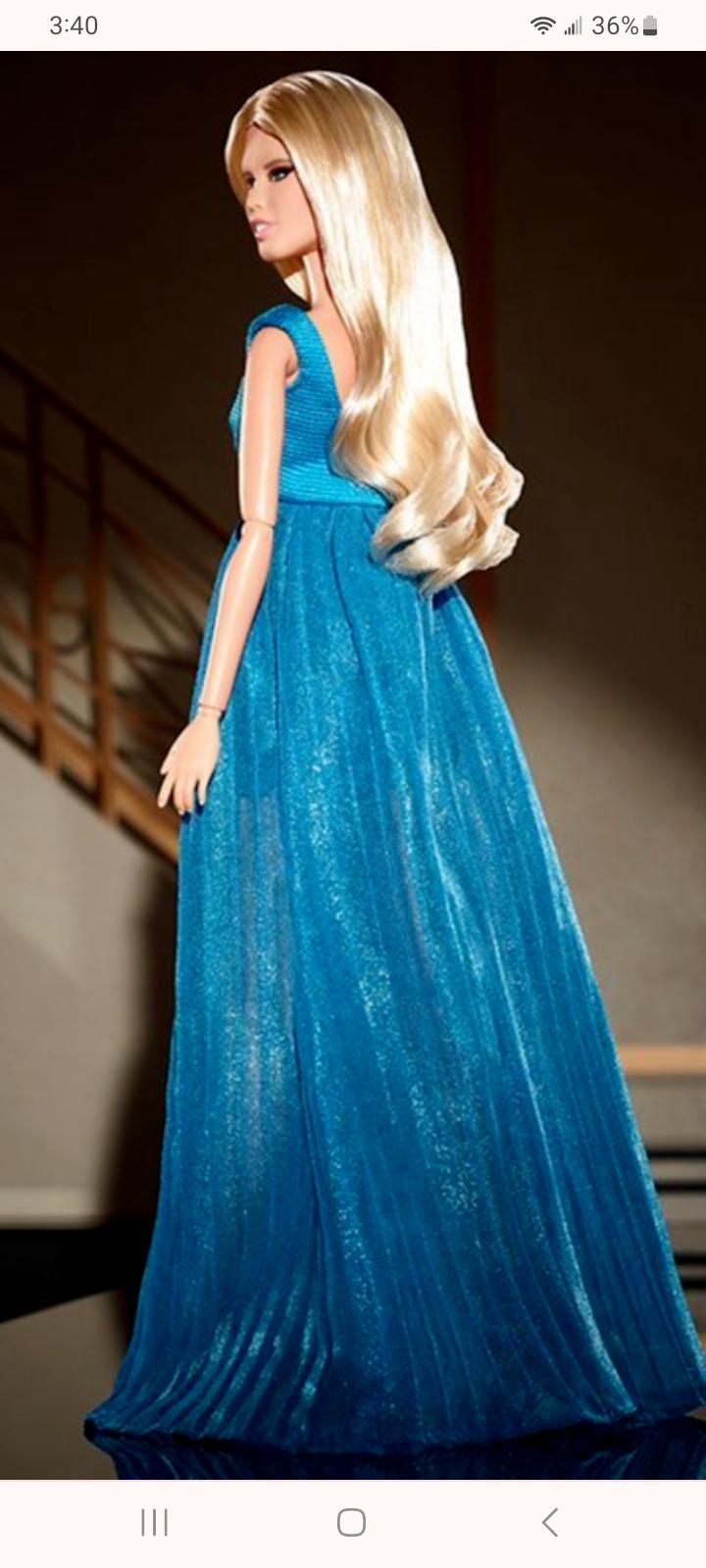 I am really torn after seeing a leak of the Claudia Barbie display box. 😭  Why does the dress look so ill-fitting, and her hair isnt quite right. I  wish they could