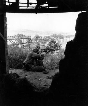 U.S. Marine aiming an M1903A1 sniper rifle across the Han River in Seoul, South Korea, on September 23, 1950. [4548 x 5464]