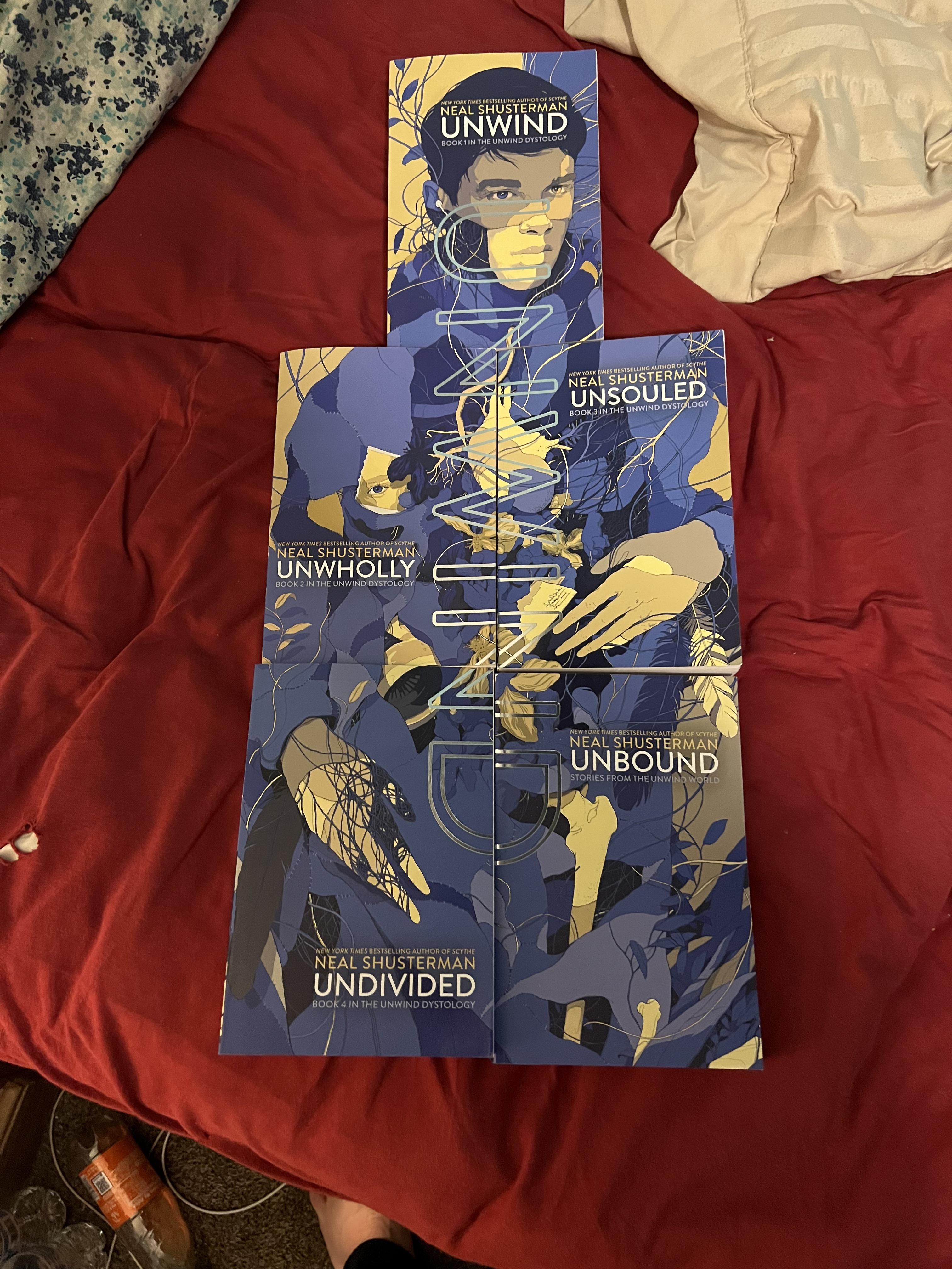 All my new cover unwind books and they look beautiful i’m on book 3