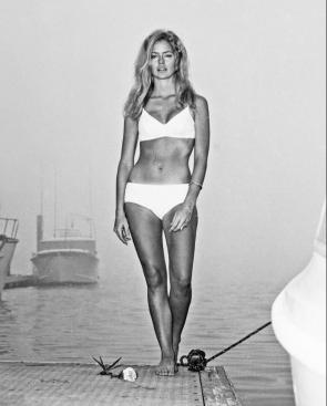Farrah Fawcett b&w, 1975, white bikini on a dock in LA.