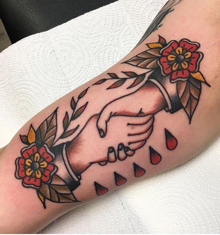 Shaking hands tattoo