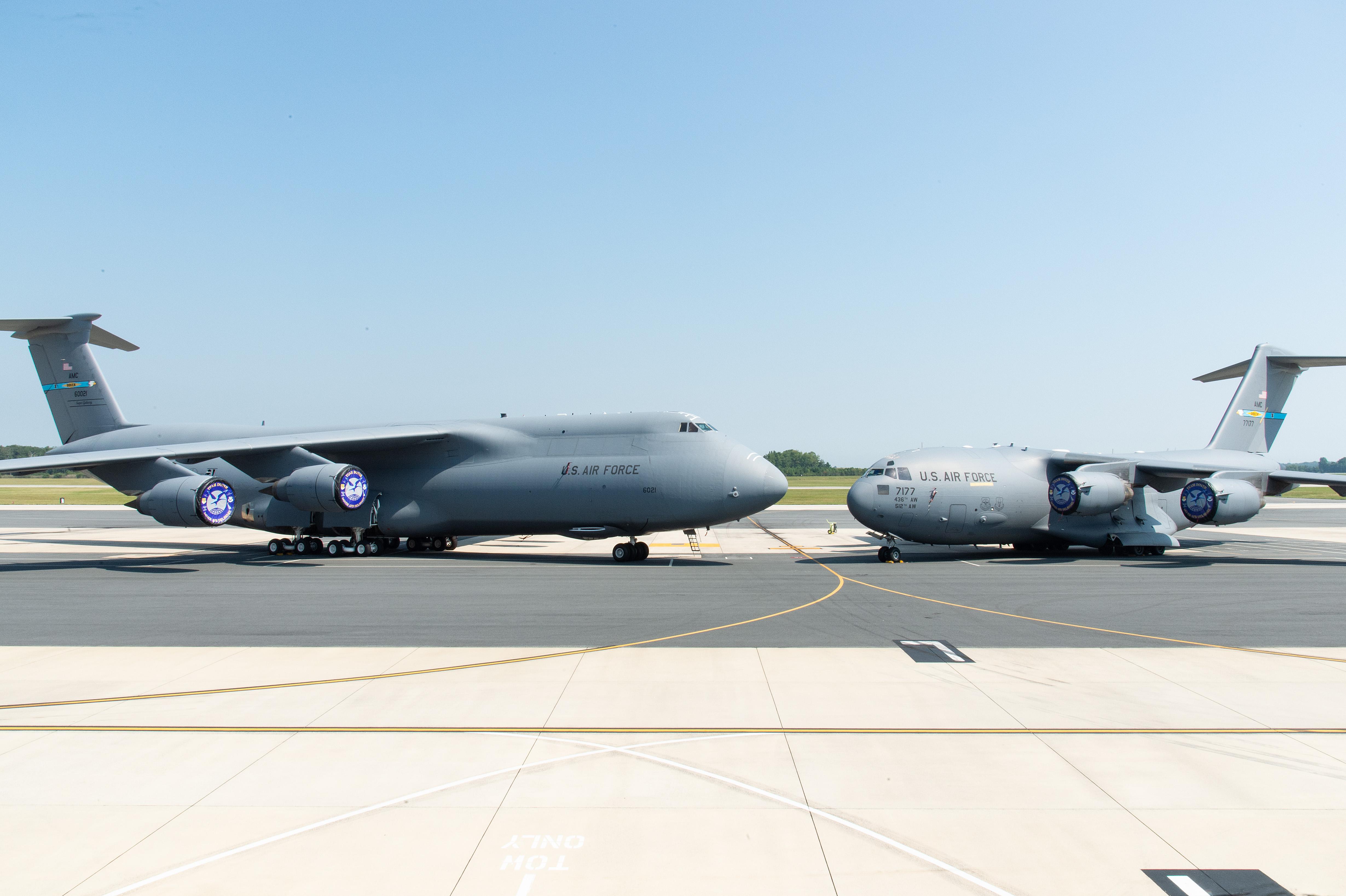 A C-5M Super Galaxy and a C-17 Globemaster III are parked nose to nose on the flight line at Dover Air Force Base, Delaware, Sept. 8, 2023. : rEngineeringPorn