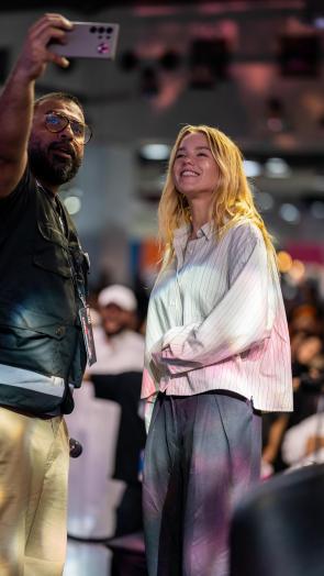 Striped shirt and Black pants | attending Day 2 of the 2025 COMFEST CON in KUWAIT | via al3ubed Instagram story – 9.26.25