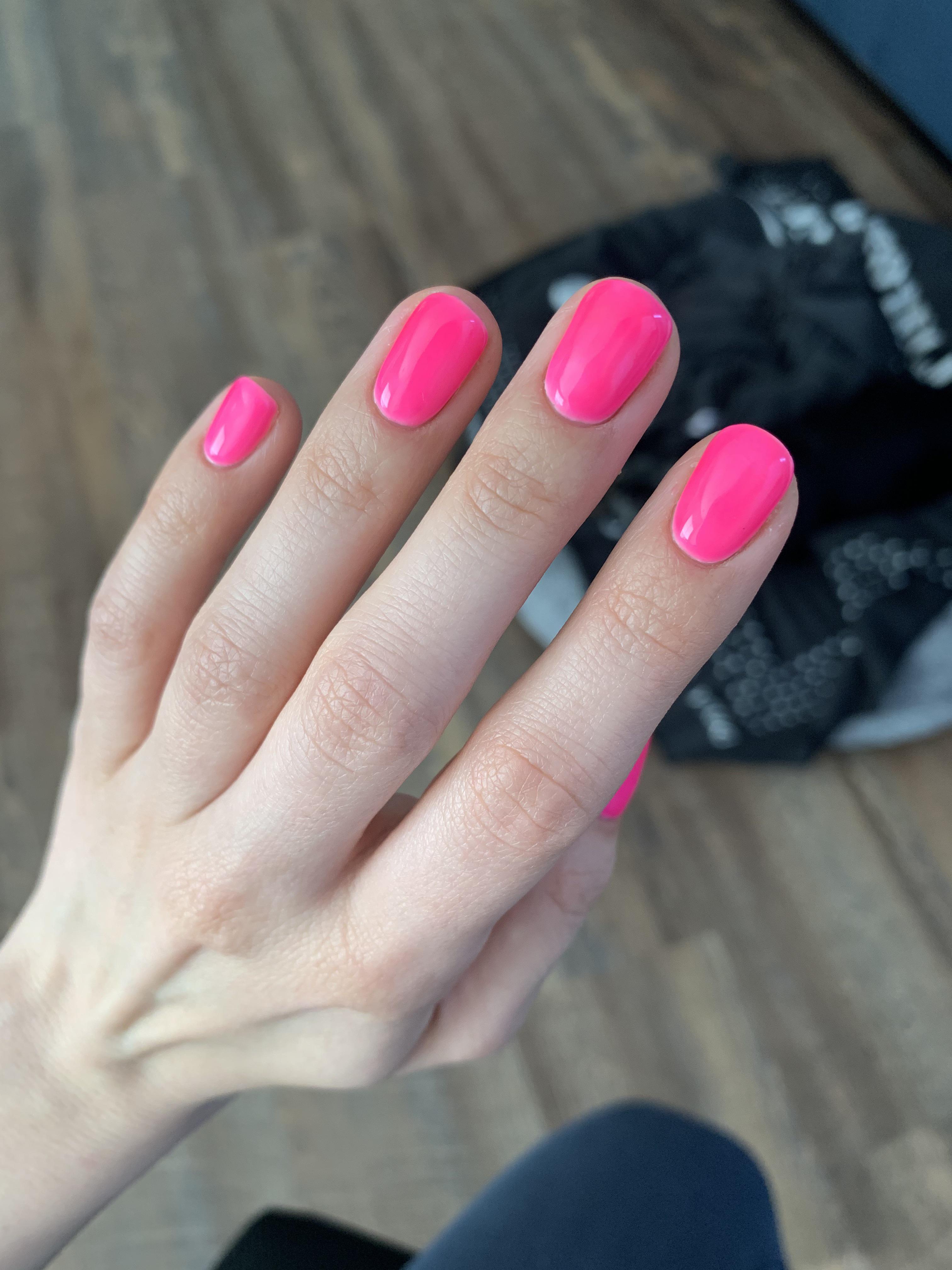 Bright neon pink summer nails.