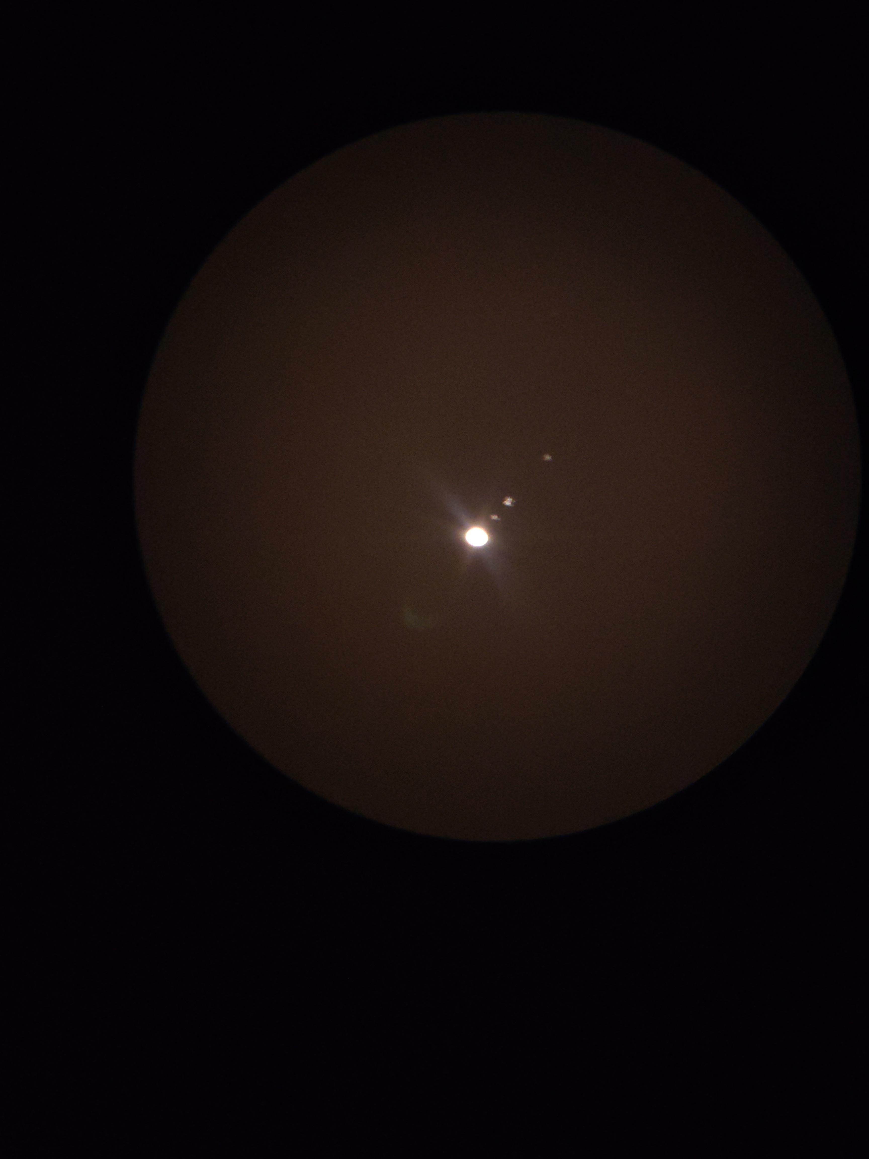 Jupiter And Its Moons Through My Telescope Celestron Astromaster 130eq Photo Taken On Phone Cam R Telescopes