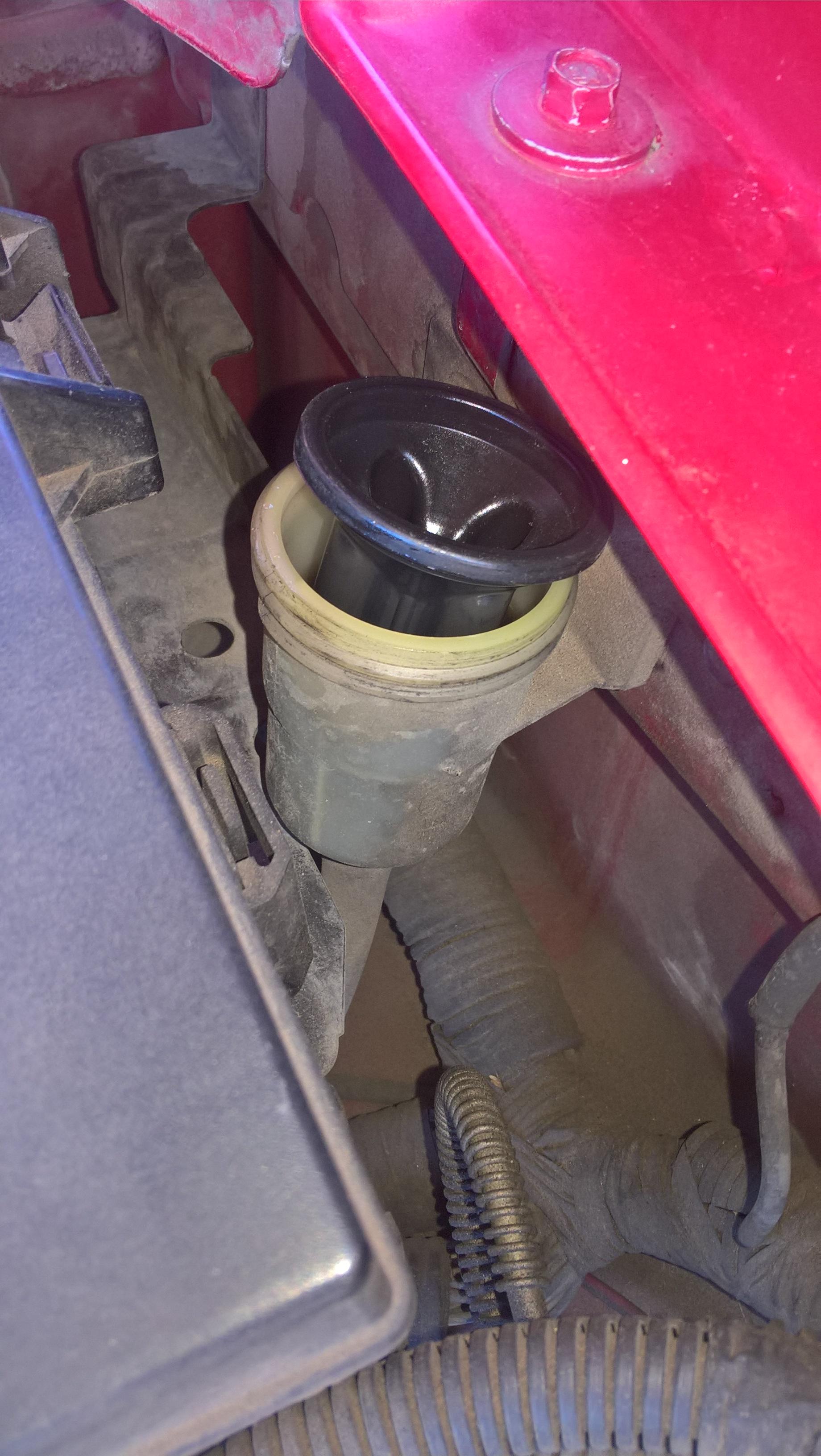 These mechanical clutch systems had many problems, requiring frequent adjusting of the clutch assembly. ford - What is the purpose of the rubber cup in the master