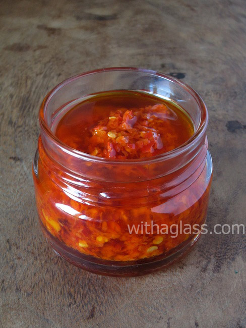 picture Preserving Chillies Italian Style with a glass