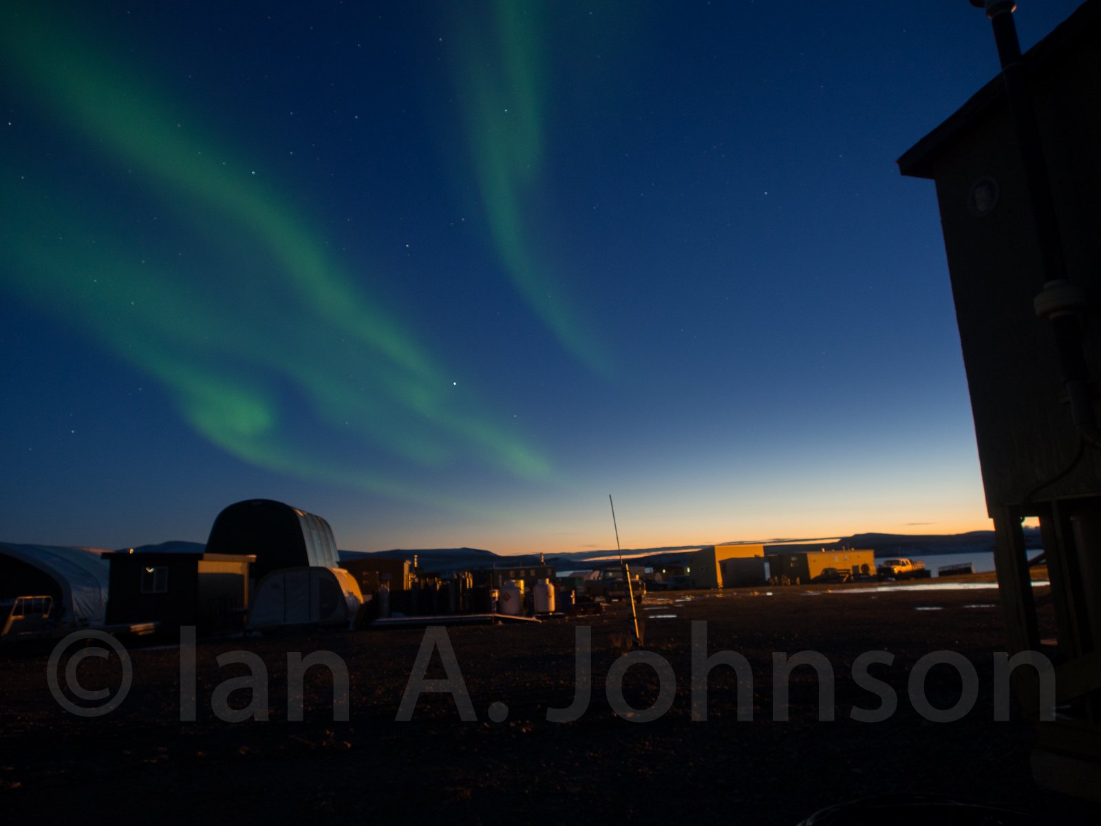 Aurora borealis in the sunset over Toolik Field Station