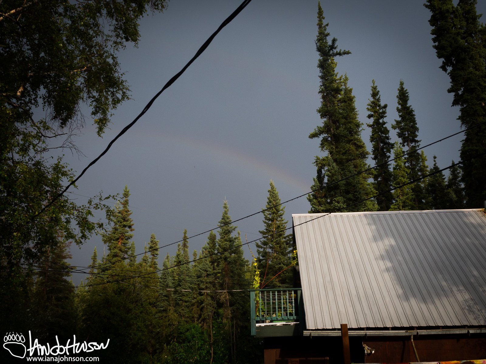 July 29th : Another rain squall brings a small rainbow over the house