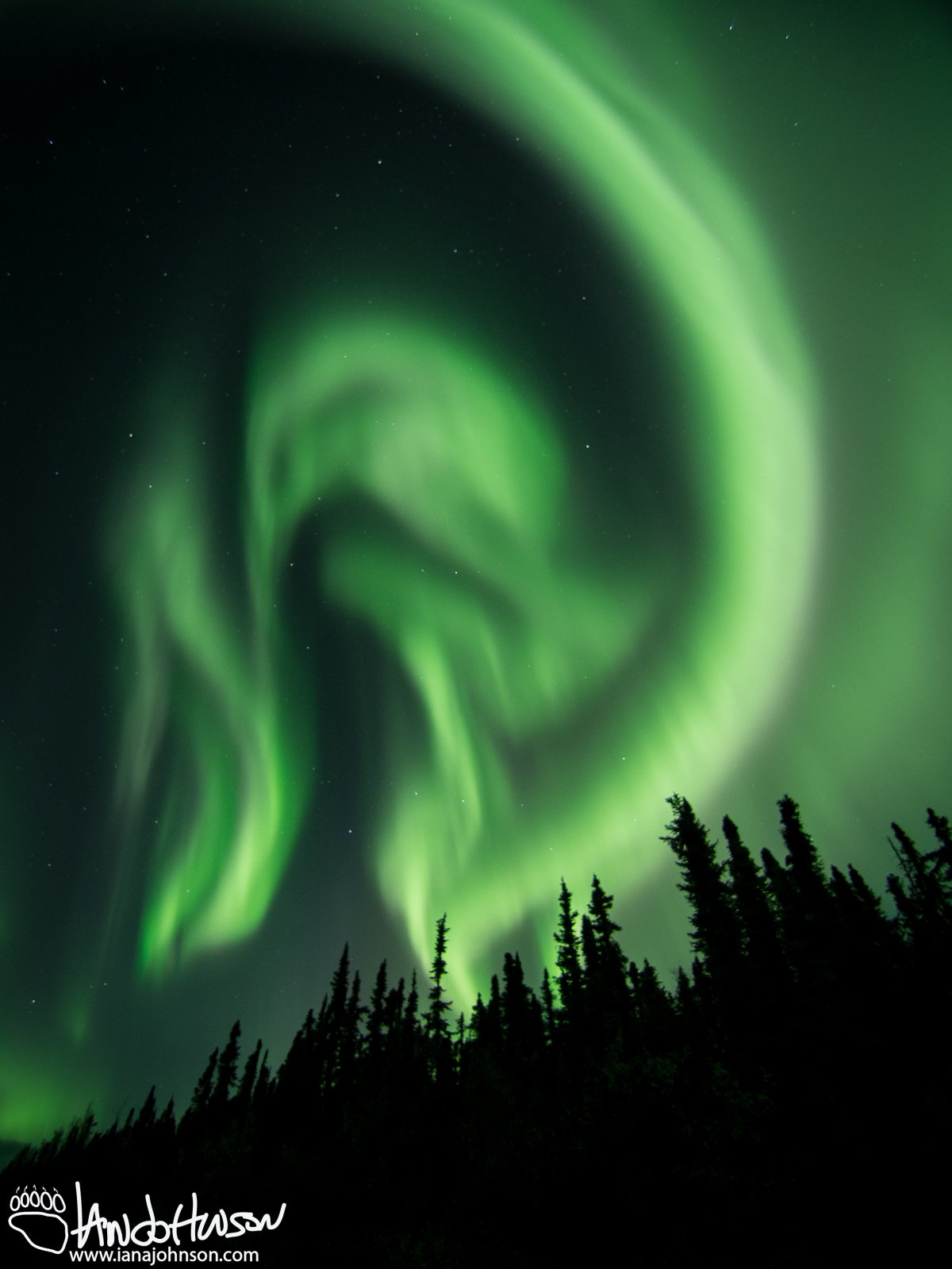 Swirling greens of aurora during a incomprehensibly large push of energy.