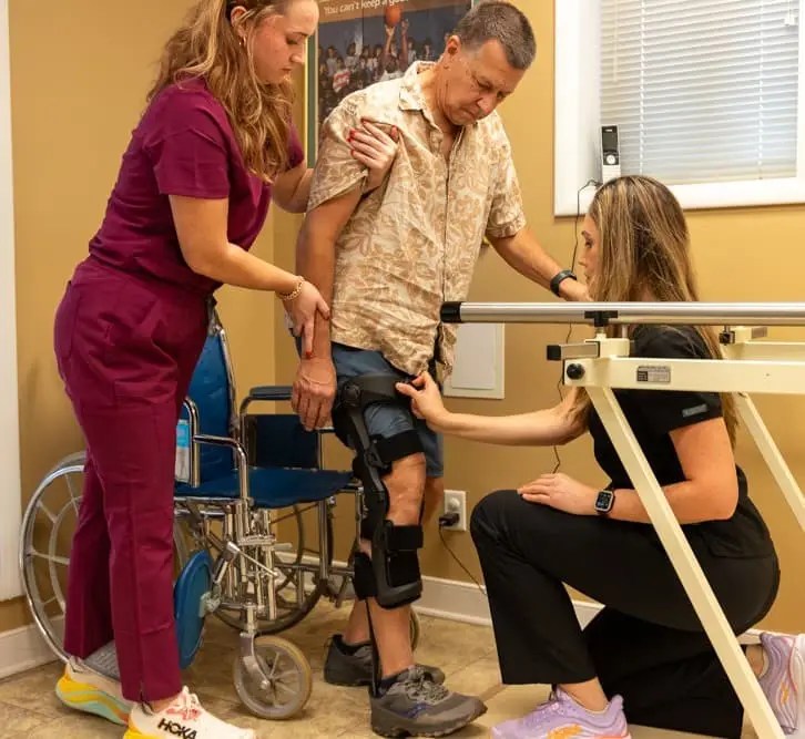 Patient with a brace being adjusted by the Flexion Control Dial