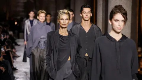 Reuters Models present creations from the Giorgio Armani Spring/Summer 2026 collection during Fashion Week in Milan, Italy, September 28, 2025.