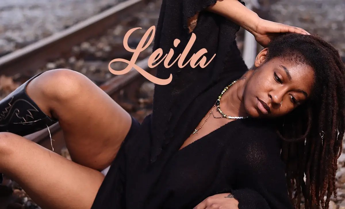 Leila Gilmore posing on railroad tracks for the August 2026 cover of Iconique Magazine.