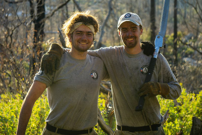 Two male AmeriCorps fire management team members