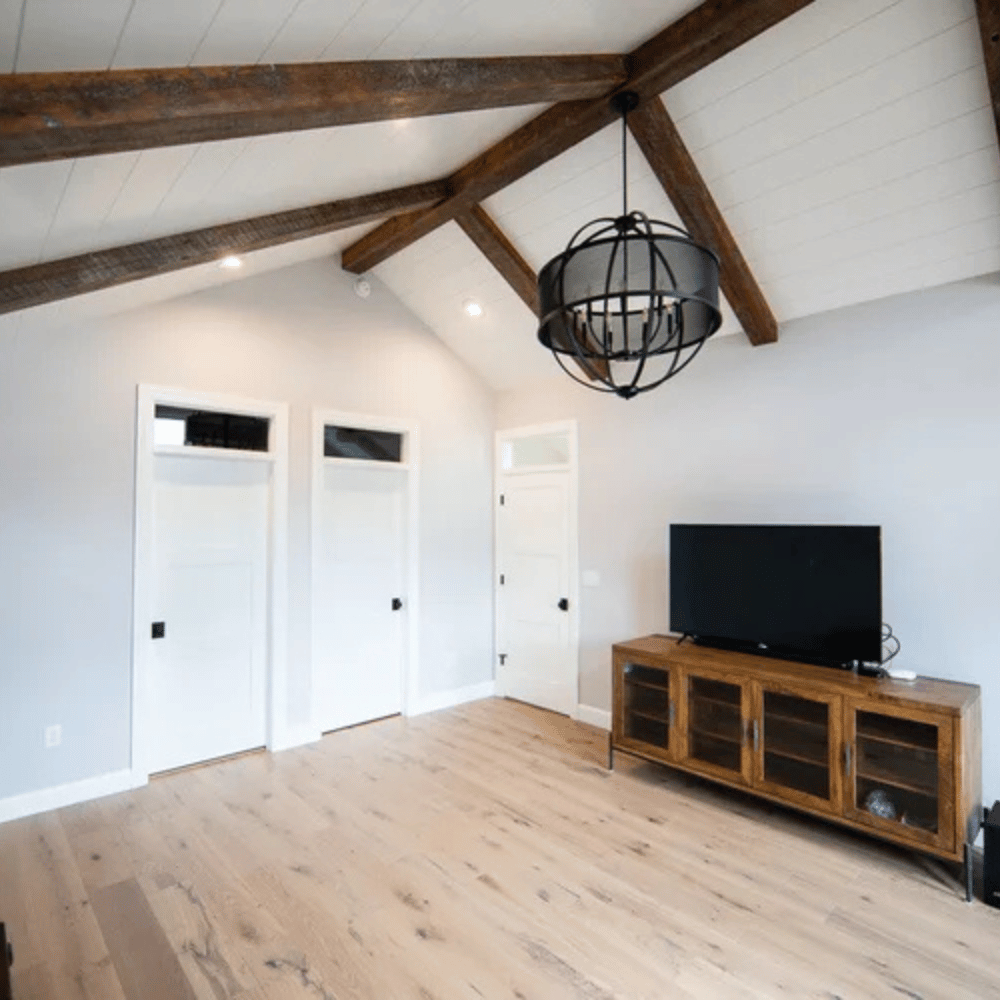Custom home expansion and structural property addition by local master craftsmen.