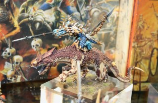 Kroq-Gar riding a Carnosaur