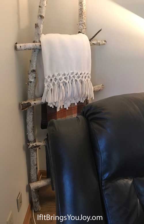 Quilt rack made of birch logs