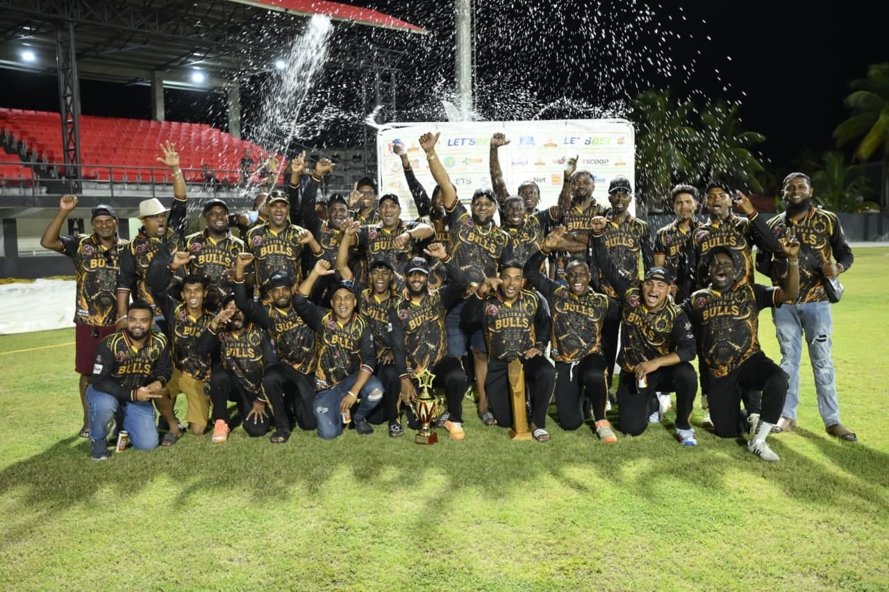 batThe jubilant Bulls celebrate their Essequibo title win