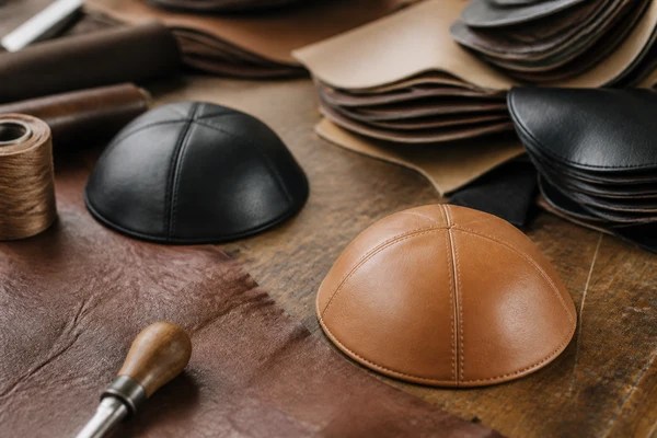 Why camel and black leather yarmulke shades dominate fall orders