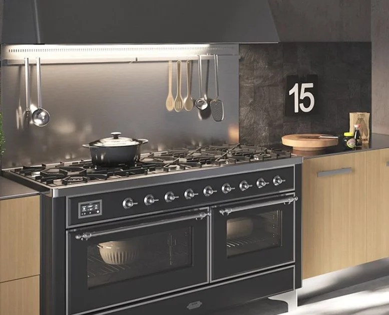Modern ILVE kitchen with dark green cabinetry featuring a professional ILVE oven and cooktop, styled for contemporary home design