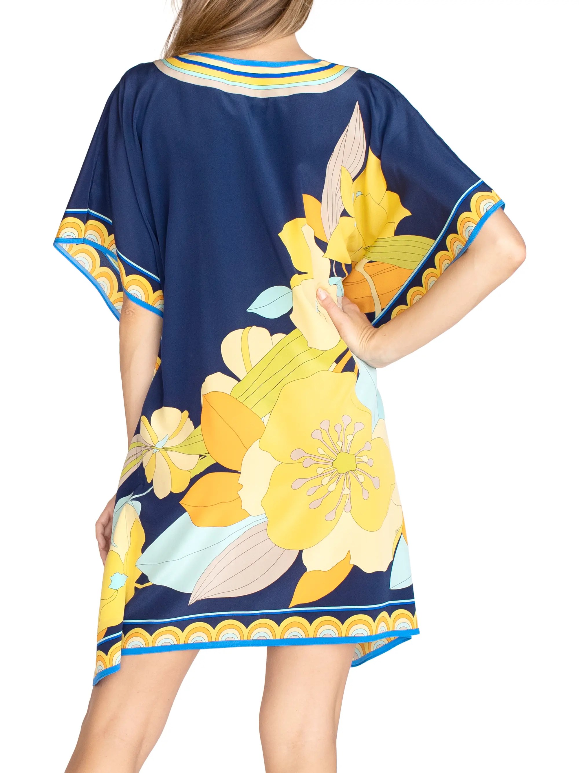 Signature to the brand's penchant for bold prints, vibrant florals accented by a border of matching stripes come to life on this silk crepe de chine dress. Shop Trina Turk Theodora Silk Caftan Dress Saks Fifth Avenue