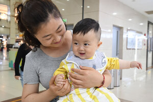 In China, motherhood begins with ‘sitting the month.’ The tradition is spreading.