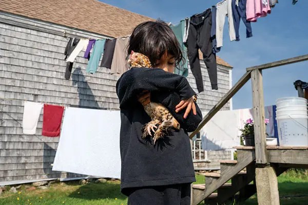 Ruby holding a chicken