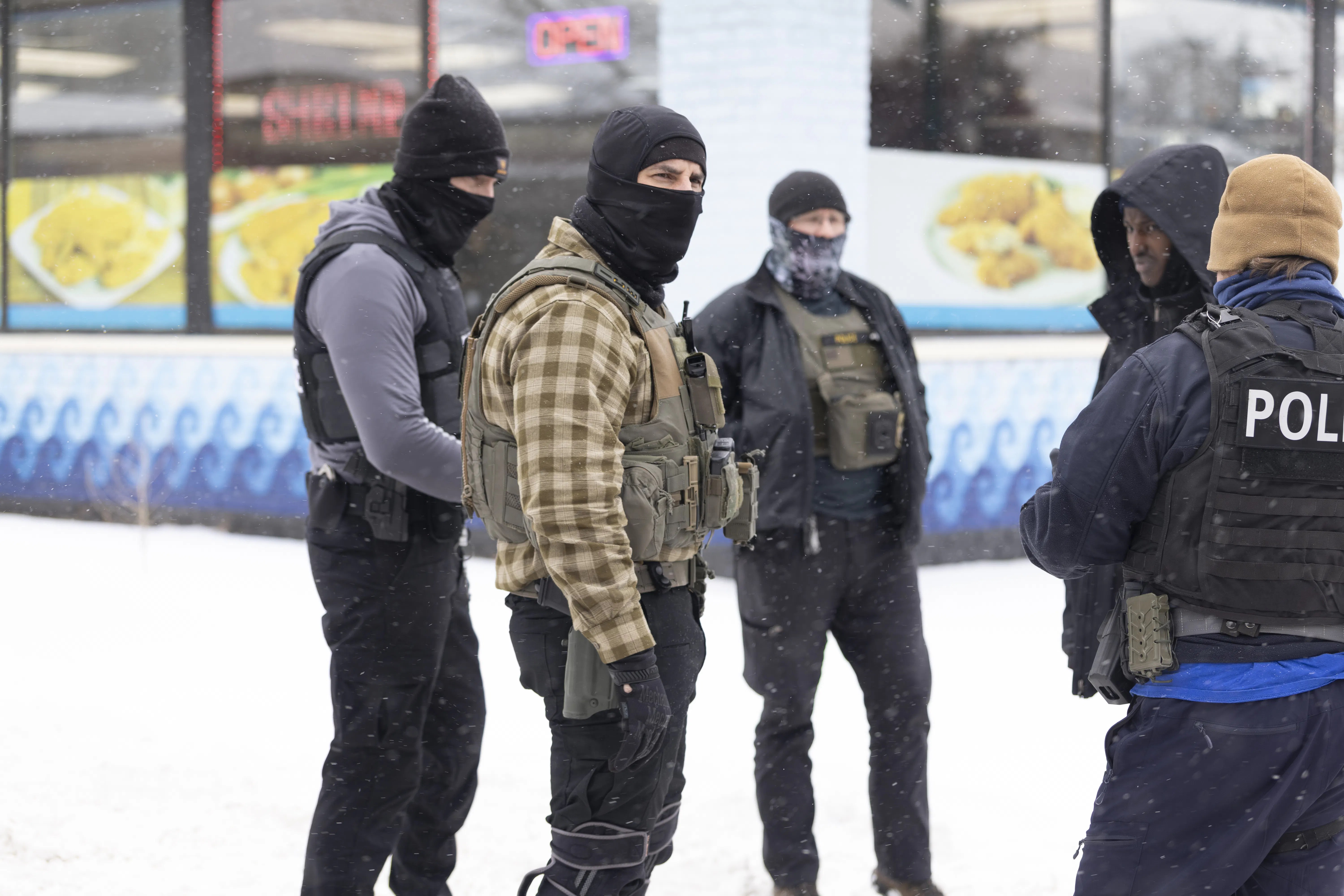 ICE Agent Kneels on Pregnant Woman as Bystanders Hurl Snowballs at Him