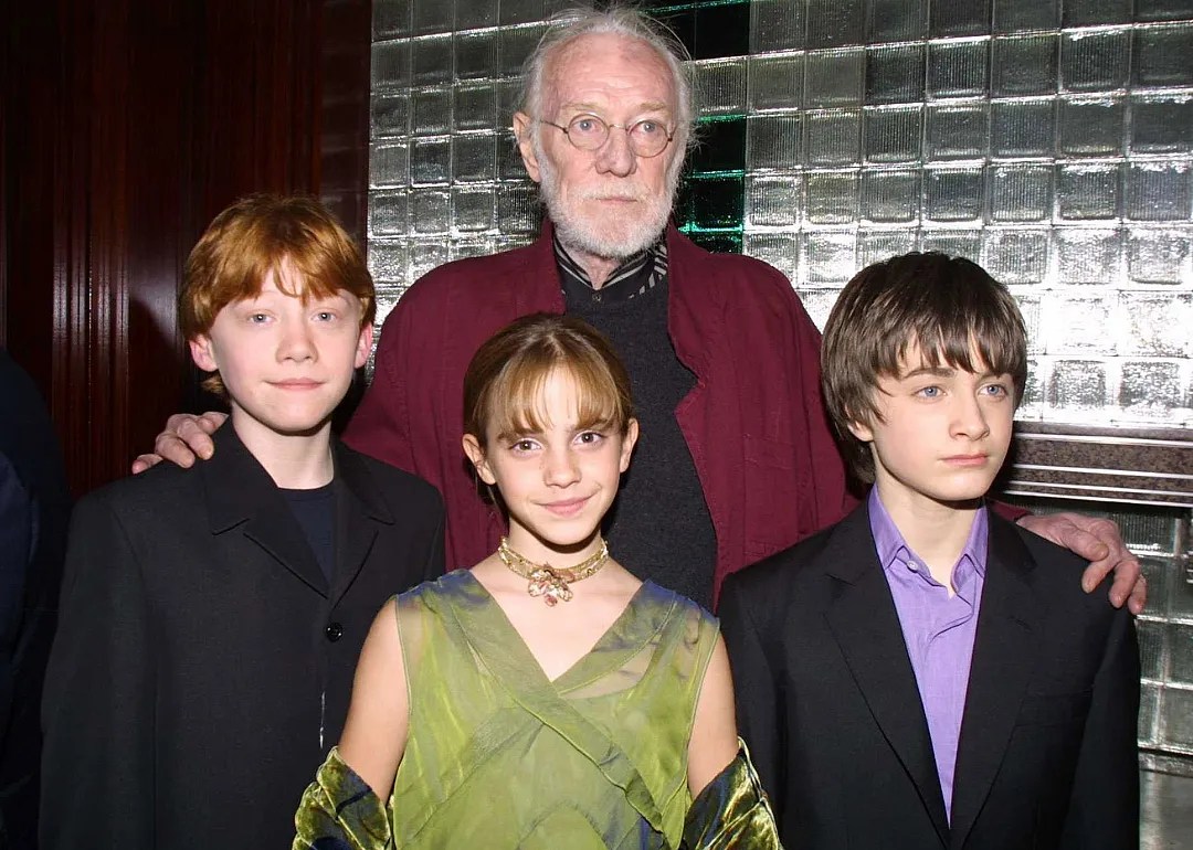 Rupert Grint, Emma Watson, Richard Harris and Daniel Radcliffe at a party after the New York premiere of 