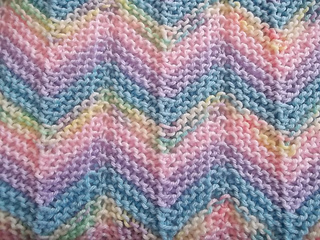 K1, yo, p4, p3tog, p4, yo, k1, yo, p4, p3tog, p4, yo, k1 row 2 and all Ravelry Knitted Chevron Ripple Afghan Pattern By Laura Mosier