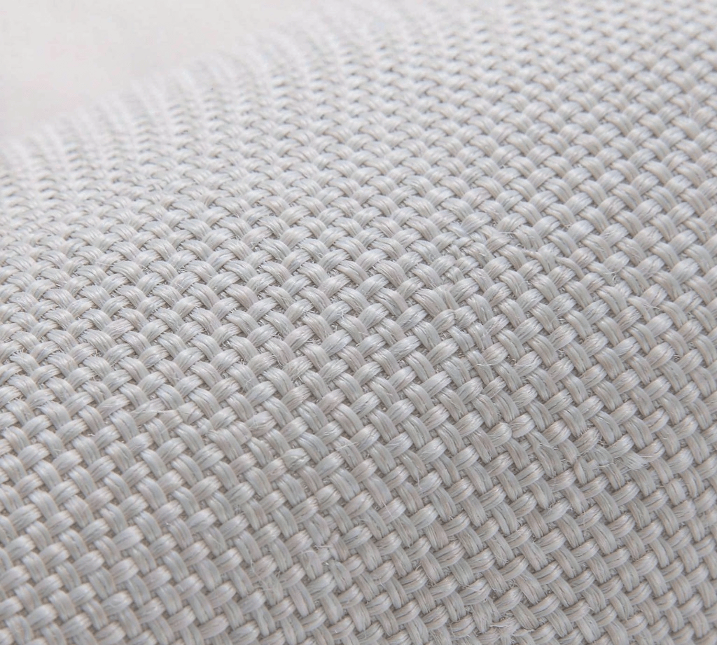 Macro view of woven fabric showing the plain weave with warp and weft threads