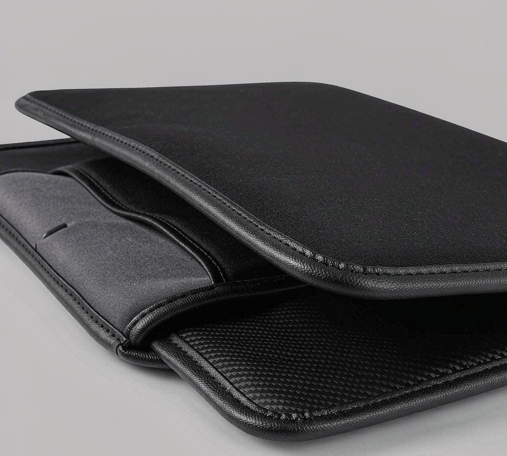 Open RFID-blocking laptop sleeve bag showing a shielded interior pocket