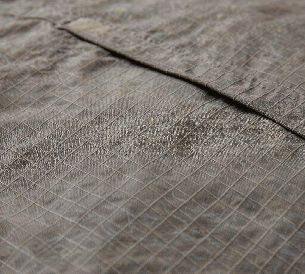 Close-up of ripstop woven fabric showing the reinforced grid threads