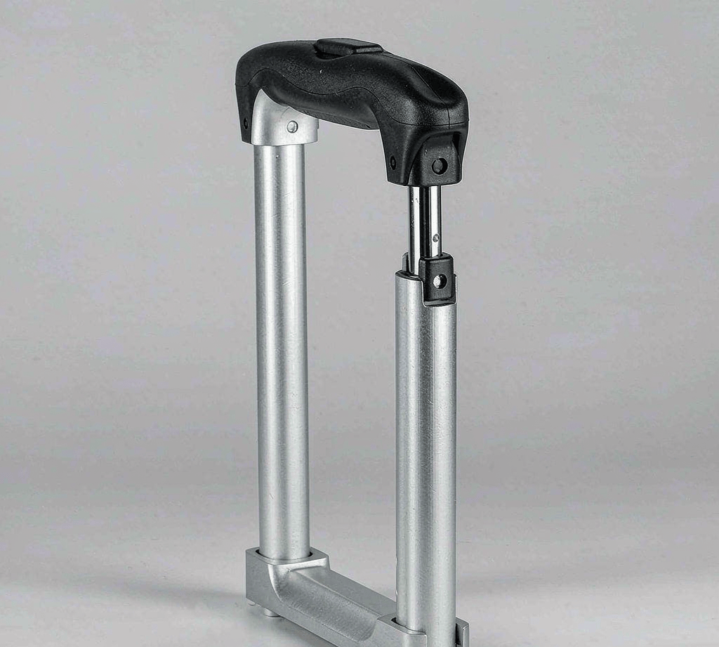 Retractable aluminum telescoping trolley handle extended on a travel case