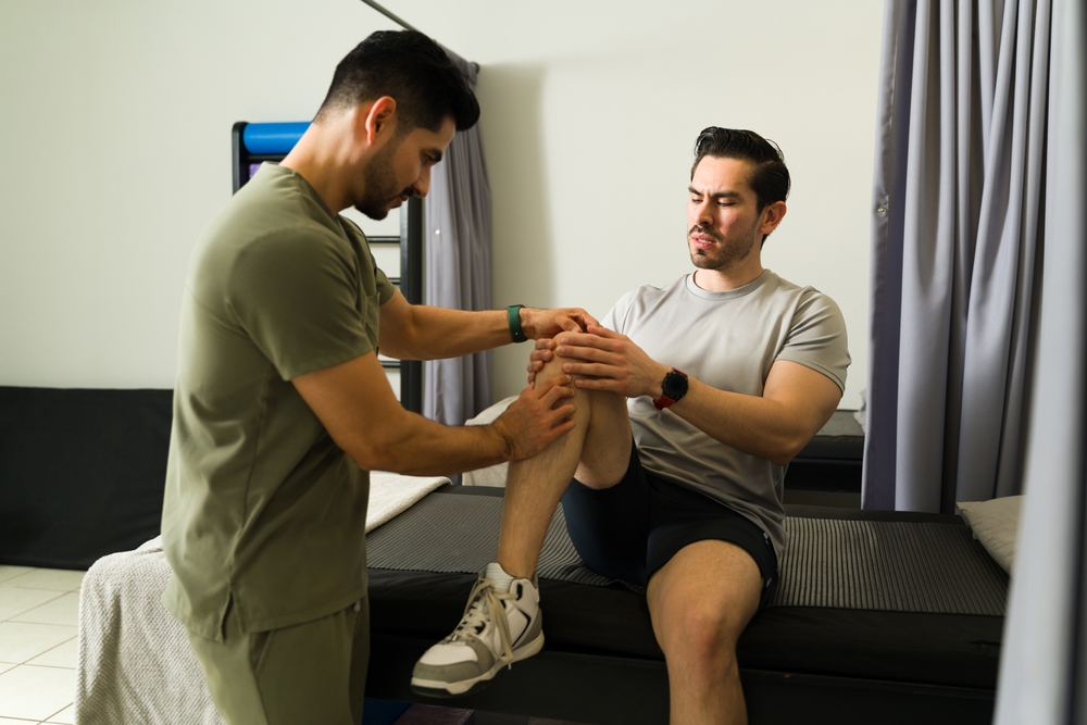 Male,Physical,Therapist,Performing,Knee,Massage,For,Patient,During,Rehabilitation