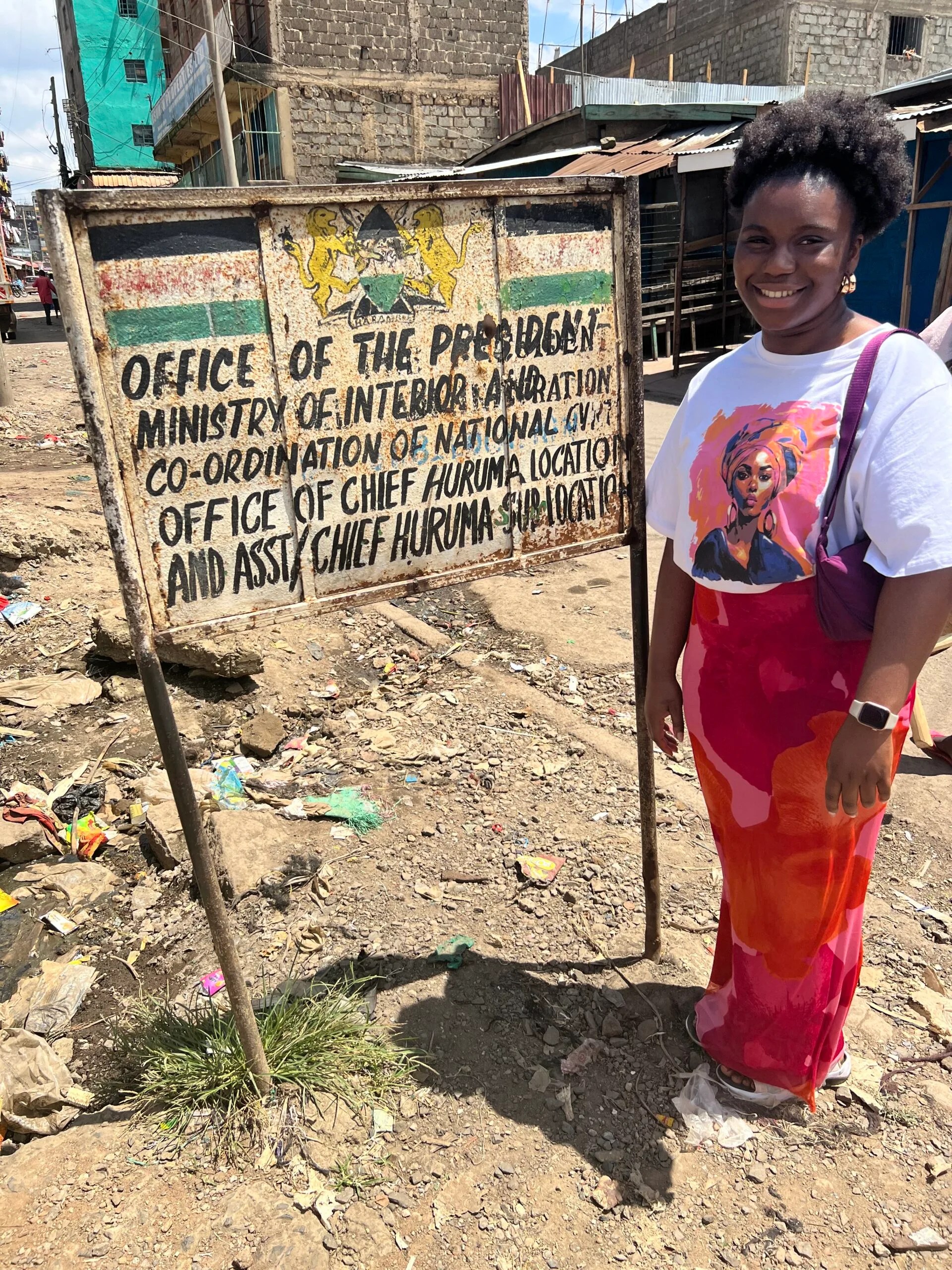 A female student outside the  Ministry of Interior and National Administration in Kenya.