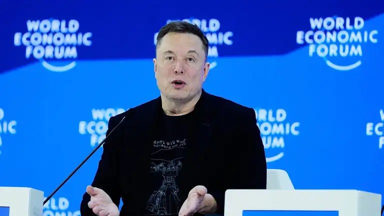 At Davos, Elon Musk Predicts a Future Where Robots Outnumber Humans