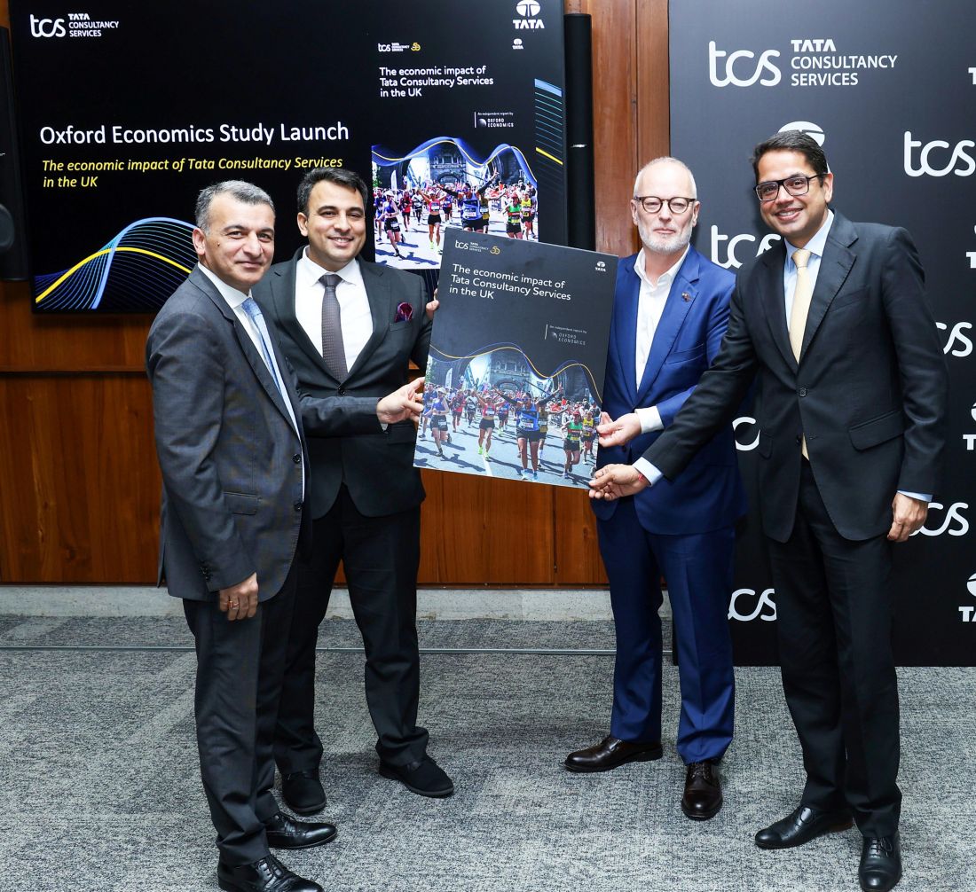 UK Minister for Investment Jason Stockwood unveils the Oxford Economics Report along with TCS leaders (L to R) Amit Kapur, Chief AI and Services Transformation Officer, Abhinav Kumar, Chief Marketing Officer and Vinay Singhvi, Head - UK & Ireland.