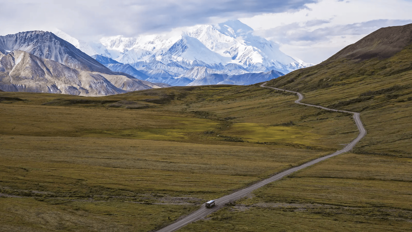 Hiking through Alaska wilderness with mountain scenery