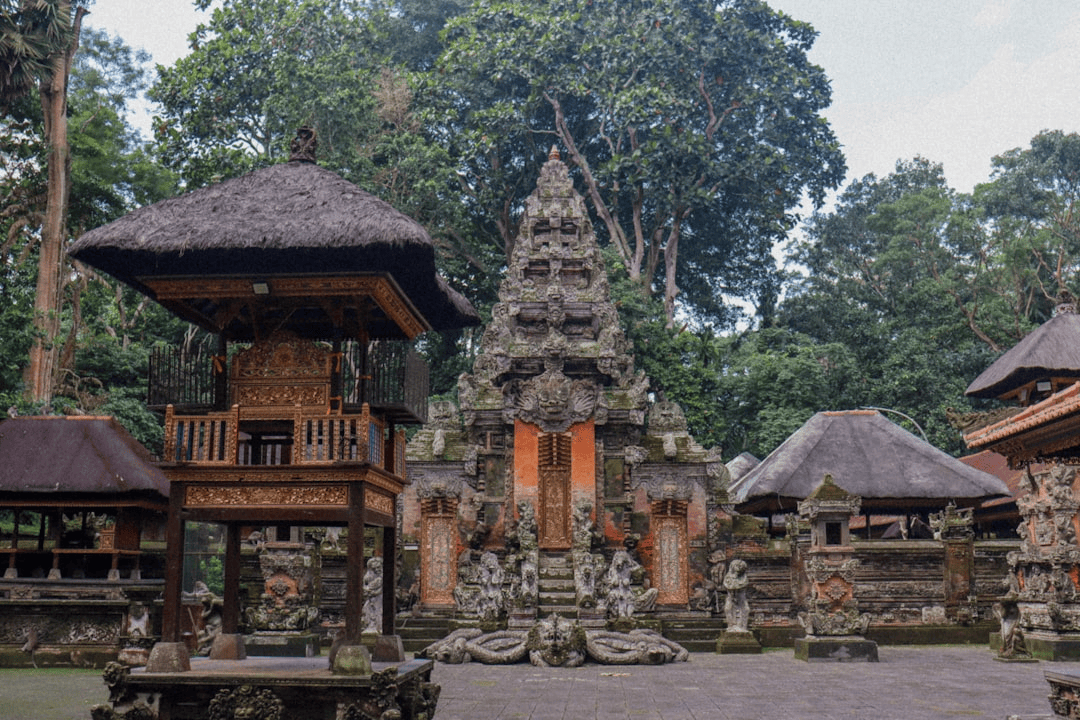 Ornate Balinese temple complex surrounded by tropical greenery