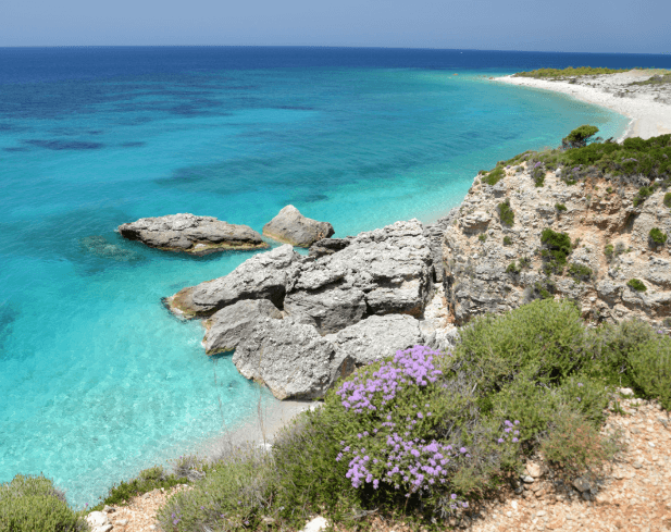 The clear water and cliffs of Dhermi beach on the Albanian Riviera