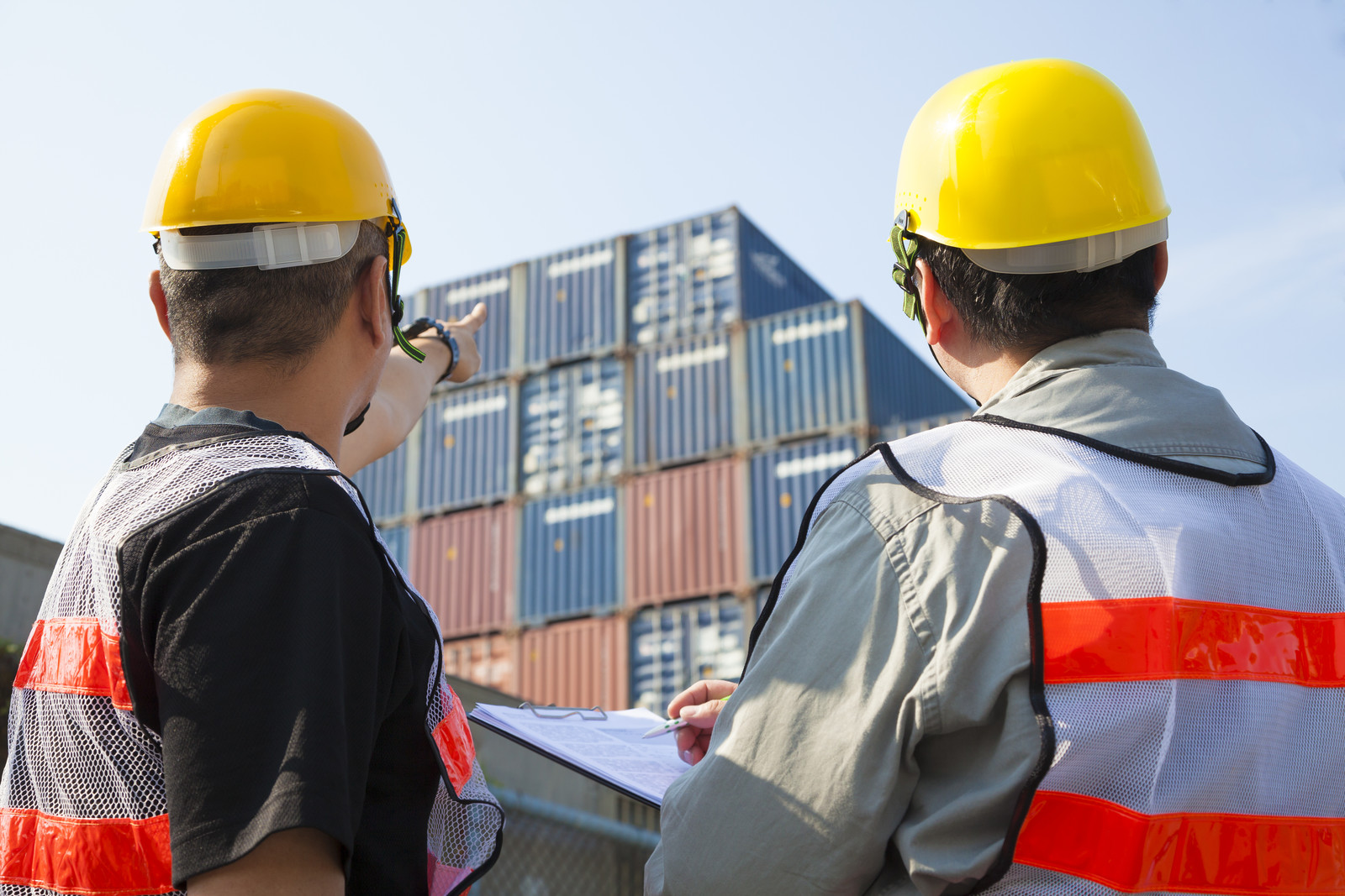 Customs authorities inspecting container with HS codes.