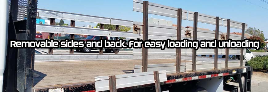 Flatbed truck with straps securing cargo