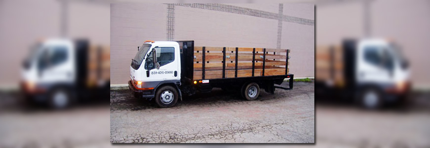 "Flatbed truck parked in a construction area"