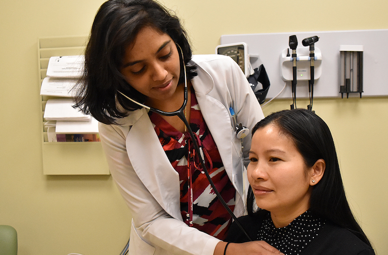 AACI doctor with patient (Image from AACI's website)