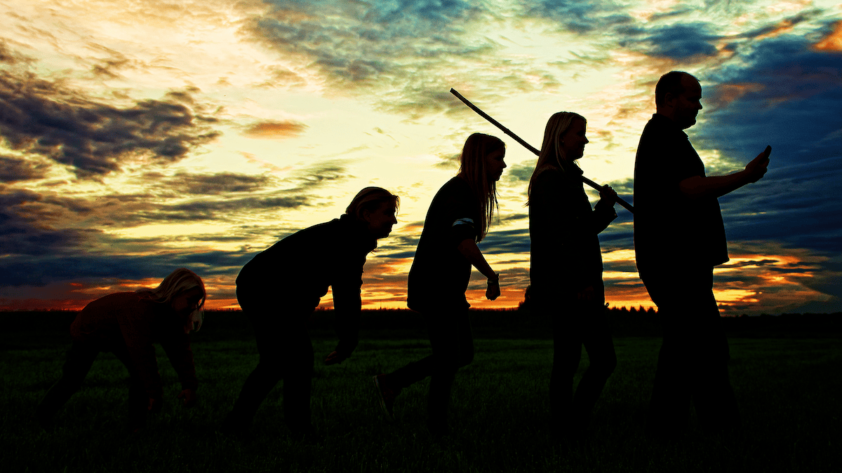 This is a representational image of human evolution. It shows silhouettes of humans in various postures, depicting evolution. The last man standing is holding a cellphone. (Photo by Johannes Plenio on Unsplash)