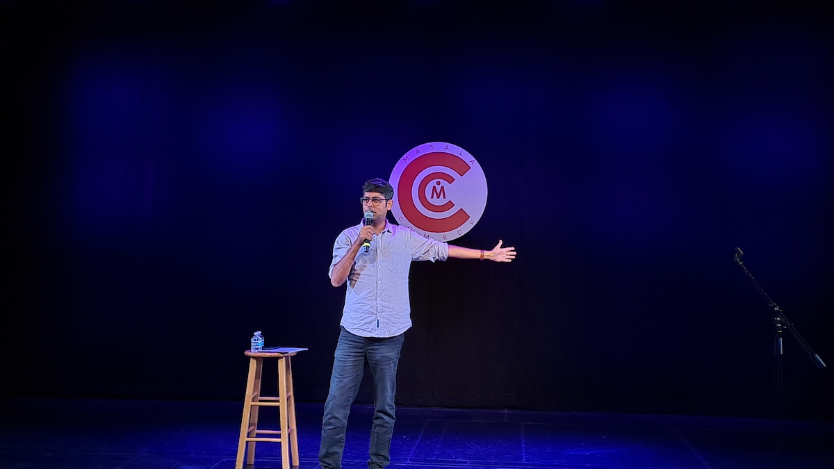 Varun Grover performing on stage.