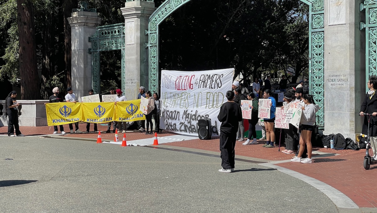 Students protest in front of Sather Gate in UC Berkeley.